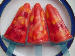 Three red Hide and Seek ice lollies on a plate