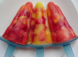 Two red and one yellow Hide and Seek ice lollies on a plate